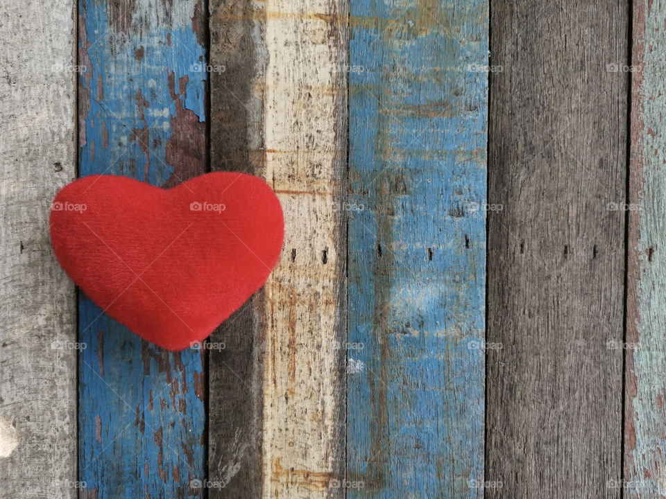 Heart on the old wooden table
