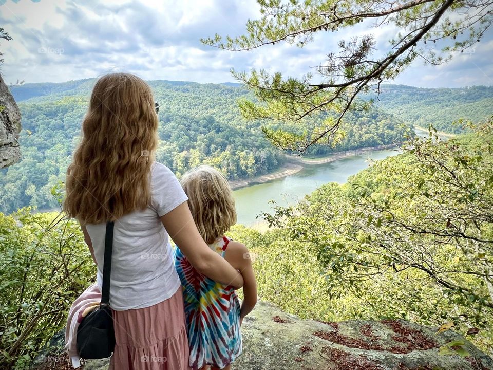 Mother & daughter enjoying the beautiful scenic views from Buzzard Rock in the mountains of Kentucky USA