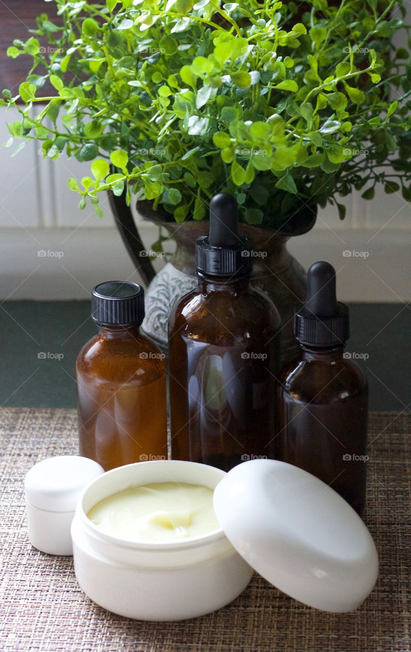 Homemade skin care products in at-home and purse-size containers