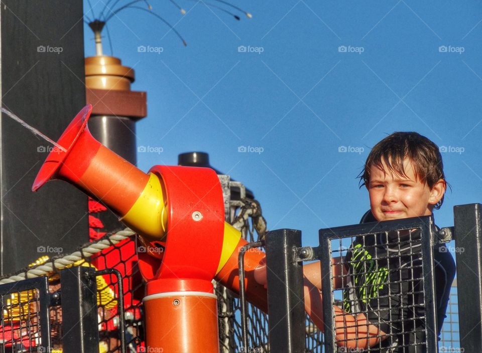 Boy Playing With Water Gun