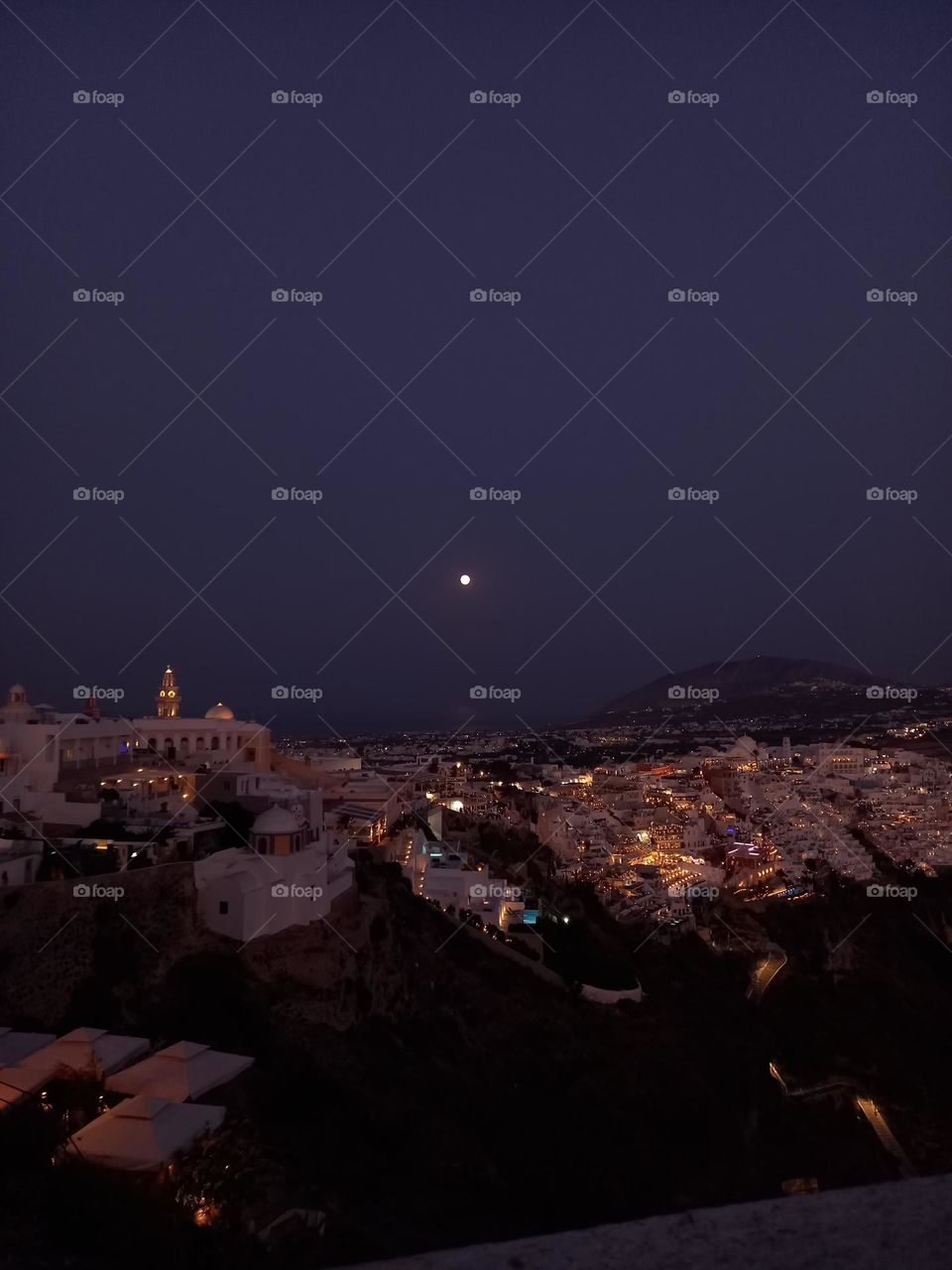 Night view of the centre of Santorini, Thira, in the moonlight of the Supermoon, July 2023.