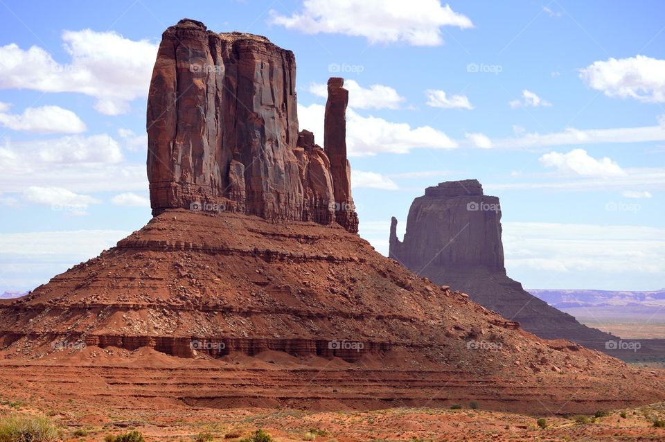 West and East Mitten buttes dot the landscape in Monument Valley Arizona. The Valley is part of the Navajo Nation. Monument height range from 100 to 1,500 feet.