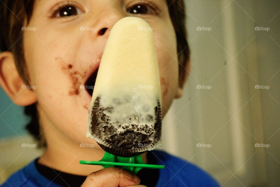 He loves his Oreo and vanilla ice pop 