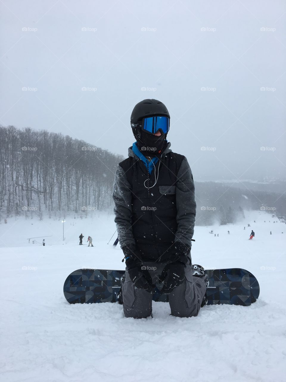 Boy snowboarding at Boyne Mountain