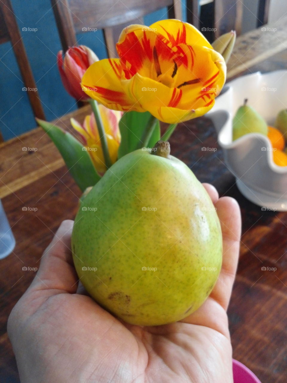 Holding a pear