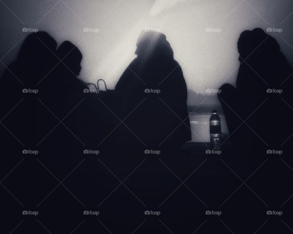 Four dudes celebrate the end of this day on the ghats of the Ganga In Varanasi 