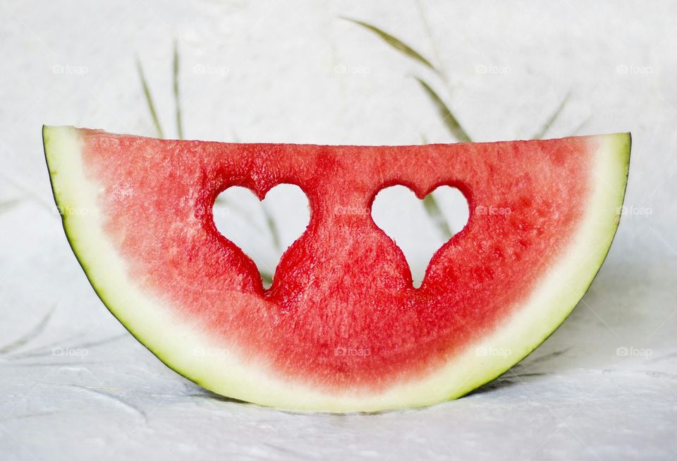 Watermelon slice with hearts shape holes