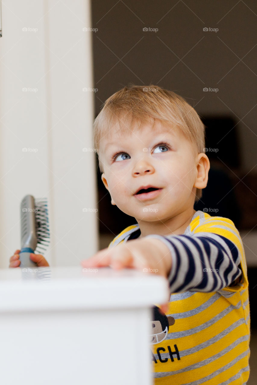 Baby boy  with hair comb.