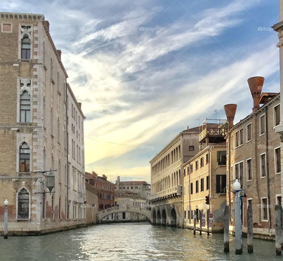 Canal in front of buildings with bridge