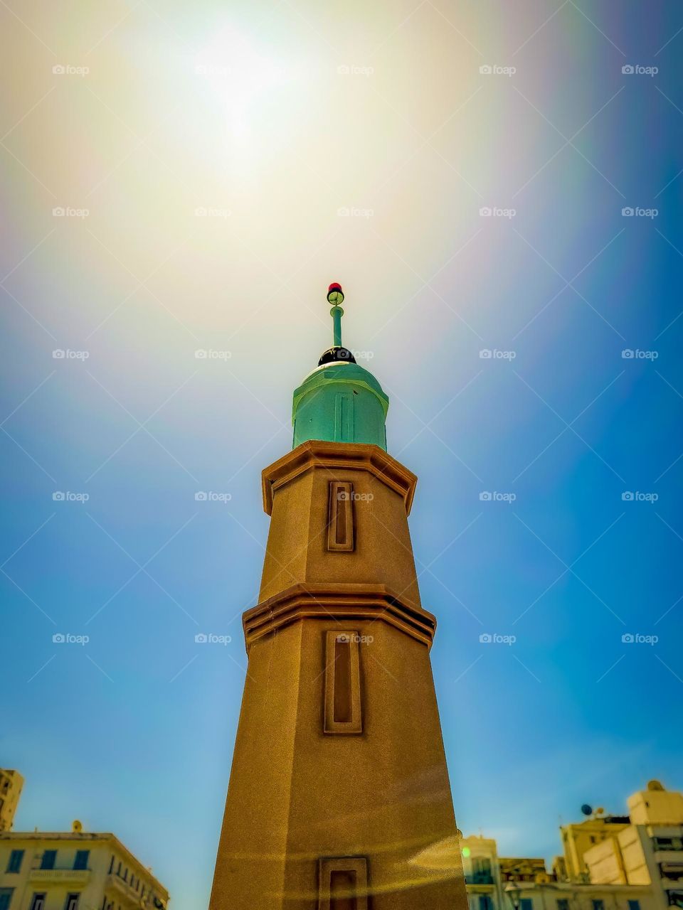 A lighthouse touches the sunny sky of Port Said