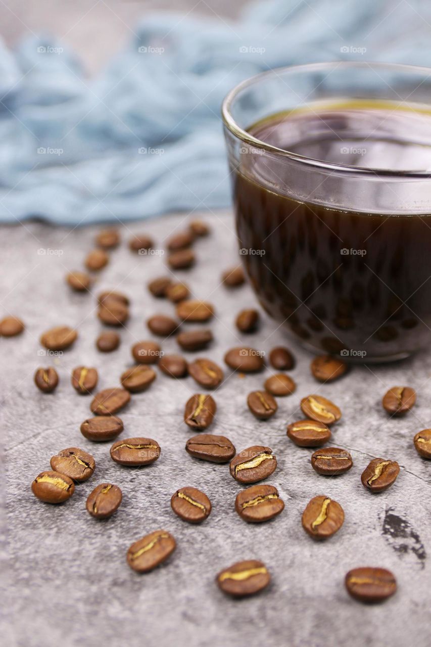 coffee beans and cup of black coffee