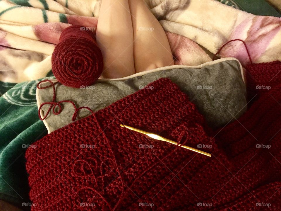 Crocheting with maroon yarn
