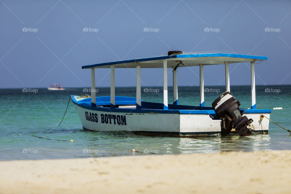 Boat Anchored On The Beach