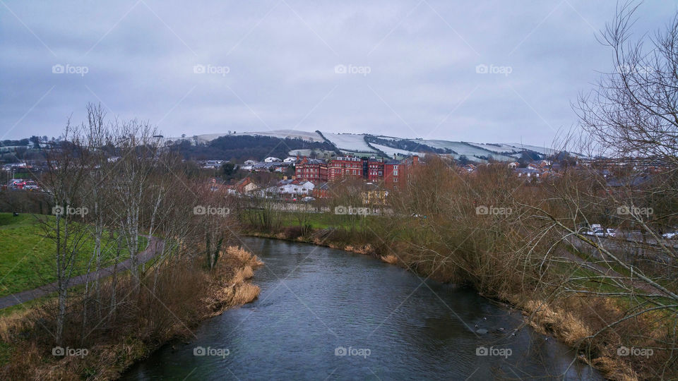 River Severn and snow covered hills in Newtown Powys