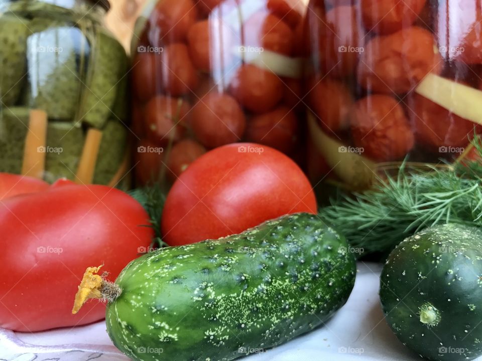 homemade pickles cucumbers and tomatoes 