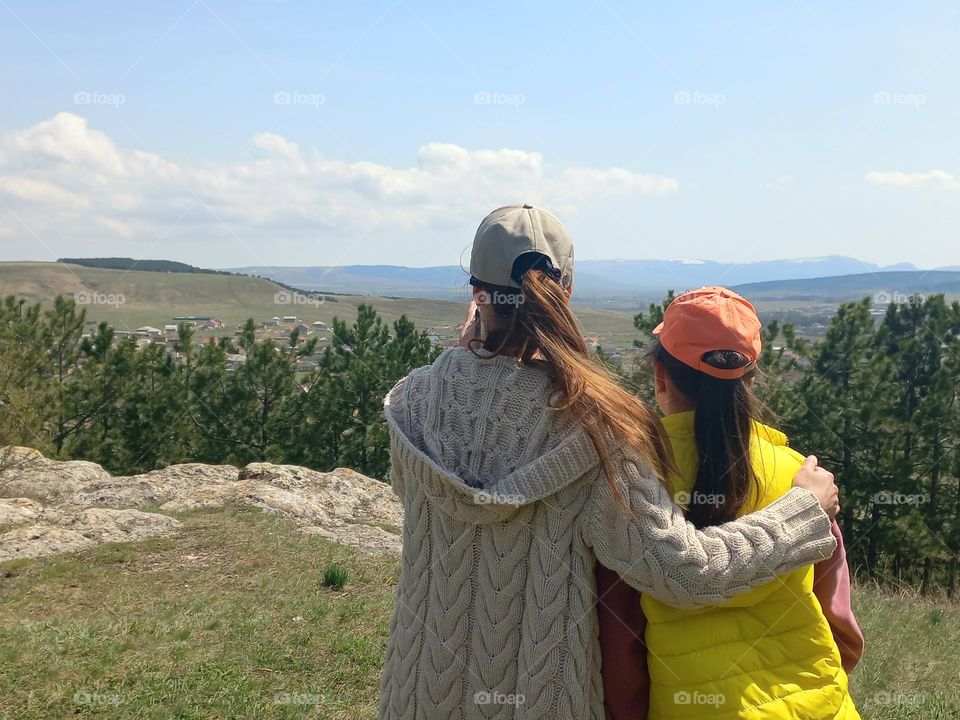 two girls admire the beautiful nature.