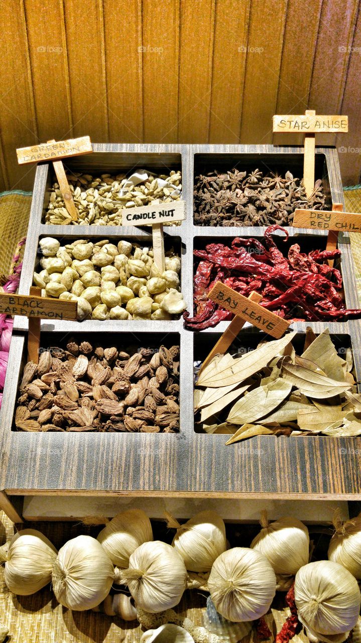 Variety of spices in wooden box