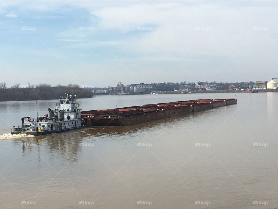 Tug pushing barge 
