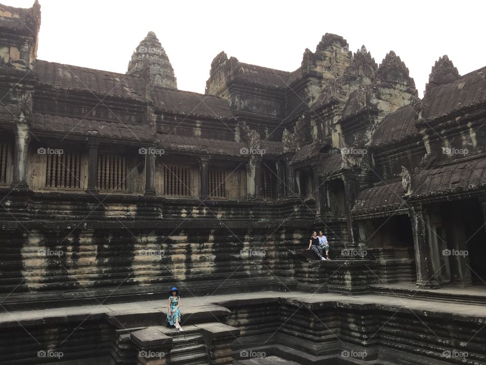 Stone buildings part of the ancient temple, Angkor Wat in Cambodia. Old architecture shows the beauty of nature. 