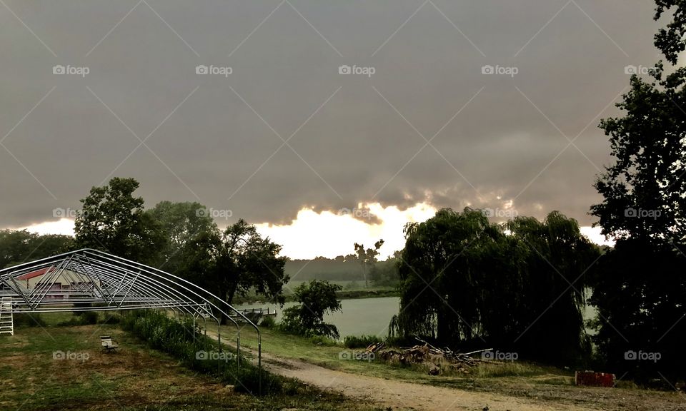 Storm rolling in, storm, cloud, clouds, lake, greenhouse, trees, grass, road, gravel, summer