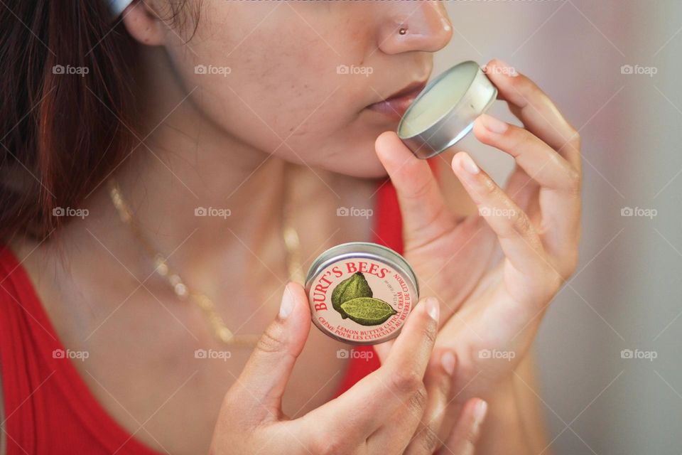 Burt's bees product in the hands of a woman