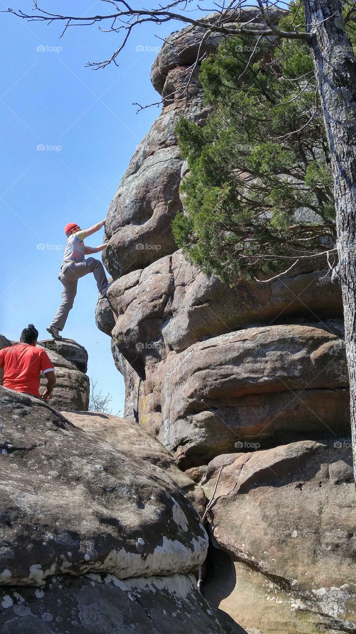 Family hikes are one of our favorite ways to stay in good shape! My stepson likes to show off his rock climbing skills!