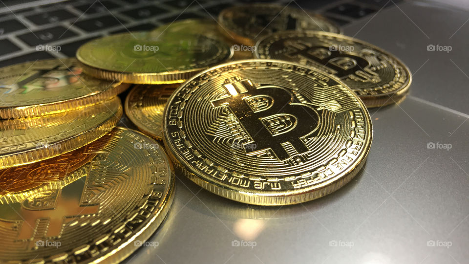 Close up on Gold bitcoin on keyboard 