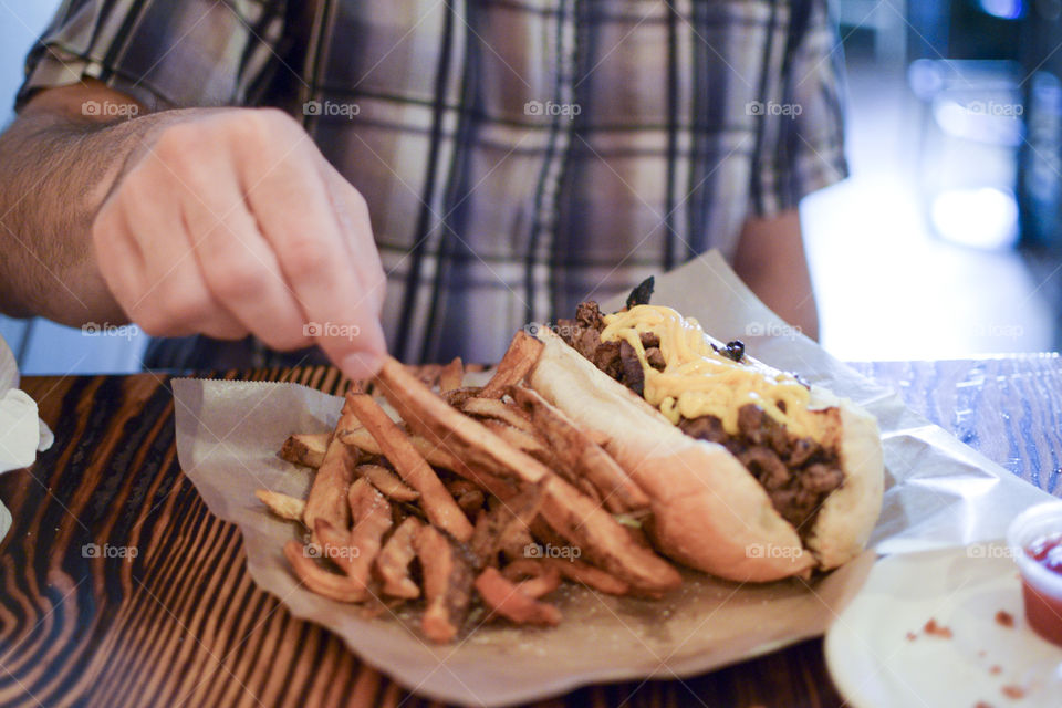Philly Cheesesteak Sandwich and Fries