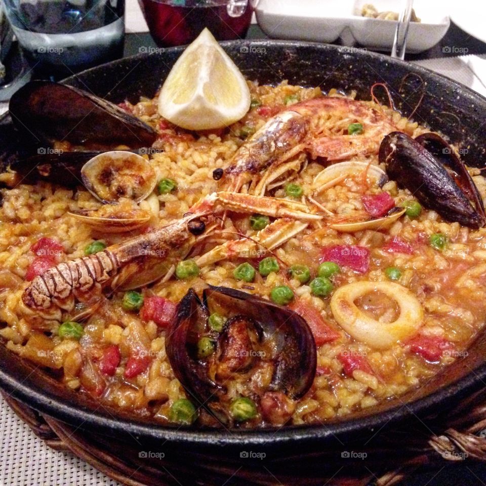 Seafood paella at the source. Eaten in the gothic quarters of Barcelona Spain while listening to some live Spanish guitar. 