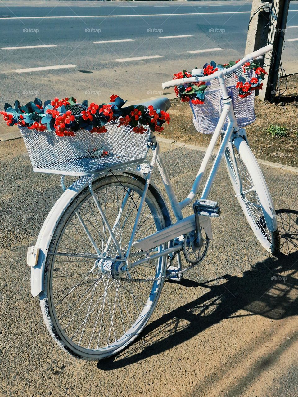 white bicycle with flowers