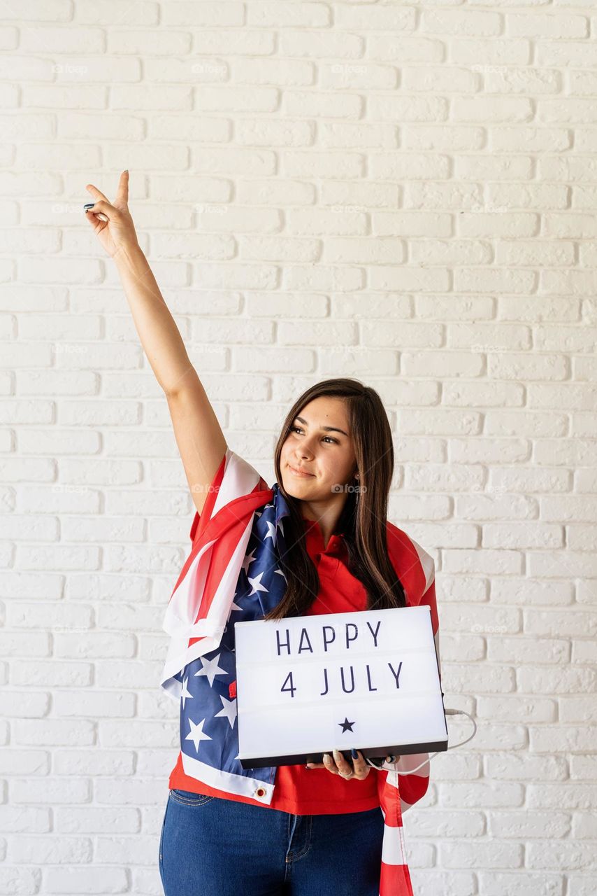 woman holding USA flag