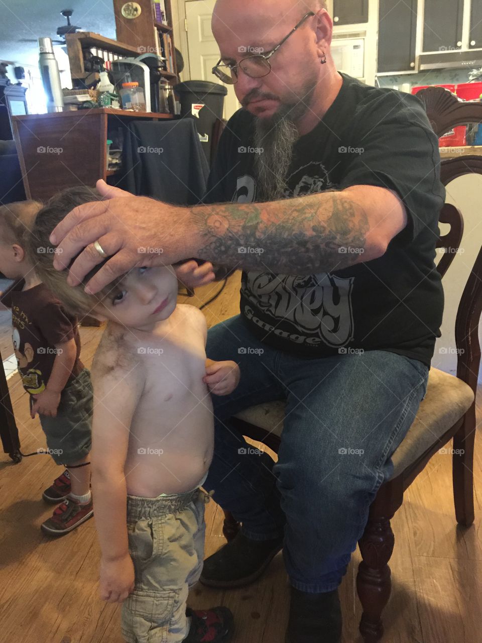  Pawpaw cutting grandsons hair on father day.