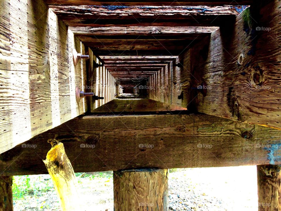 Railroad beams. Unique photo taken of the underside of railroad tracks