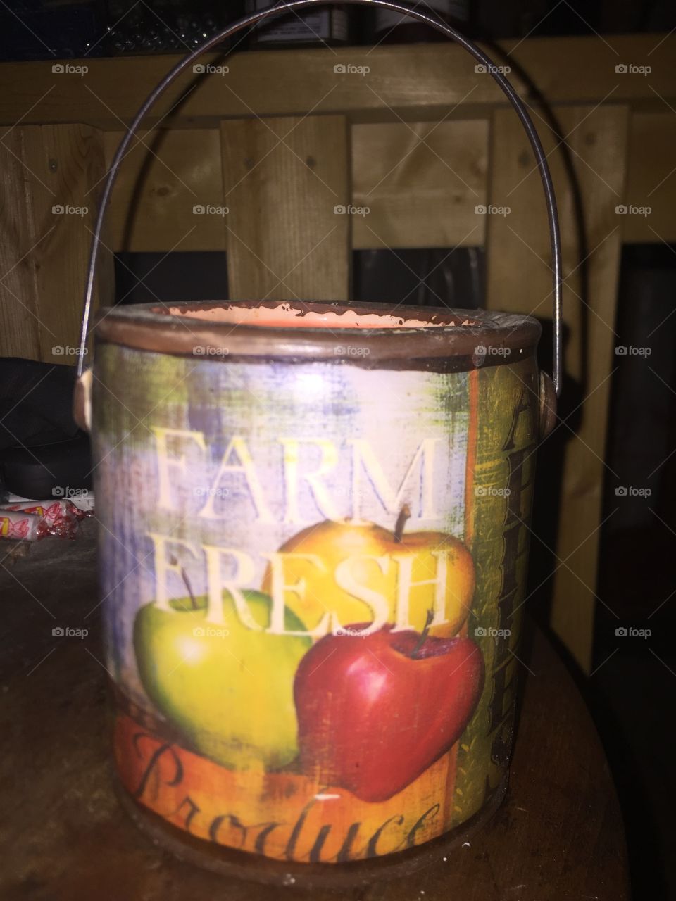 An interesting candle holder in a little tin bucket