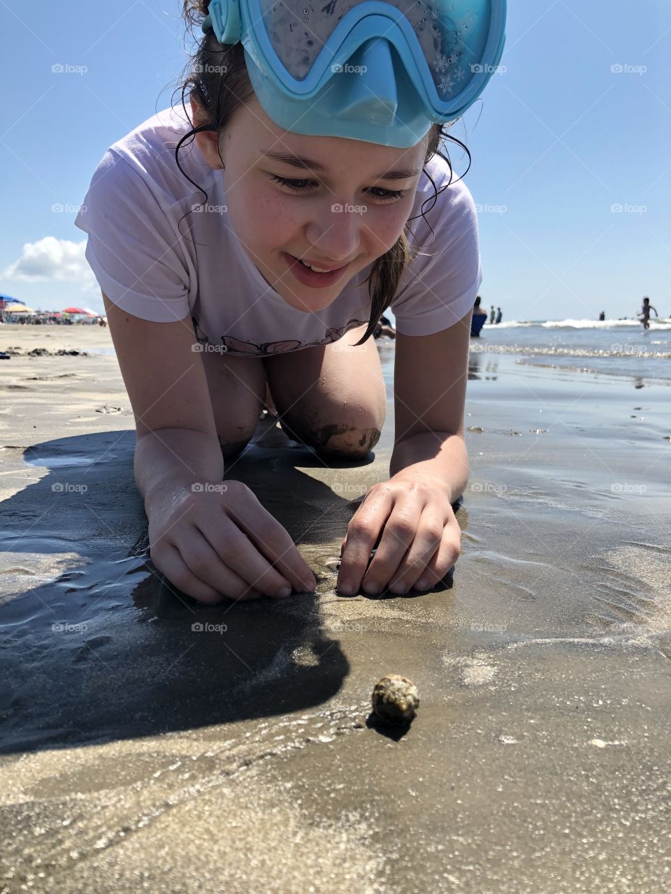 Happy Girl with hermit crab at Galveston Beach