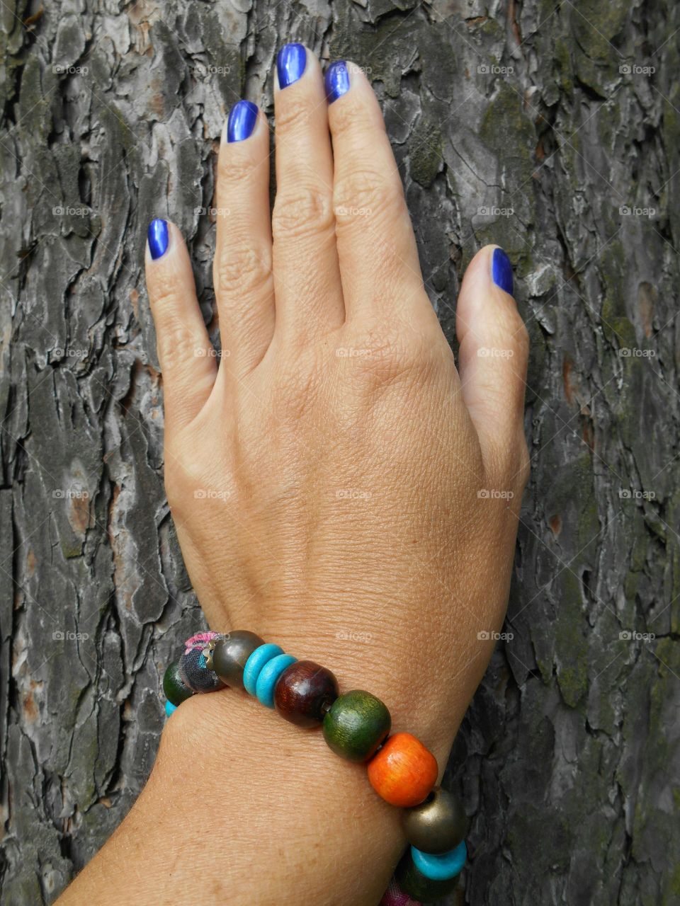 hand female and beads