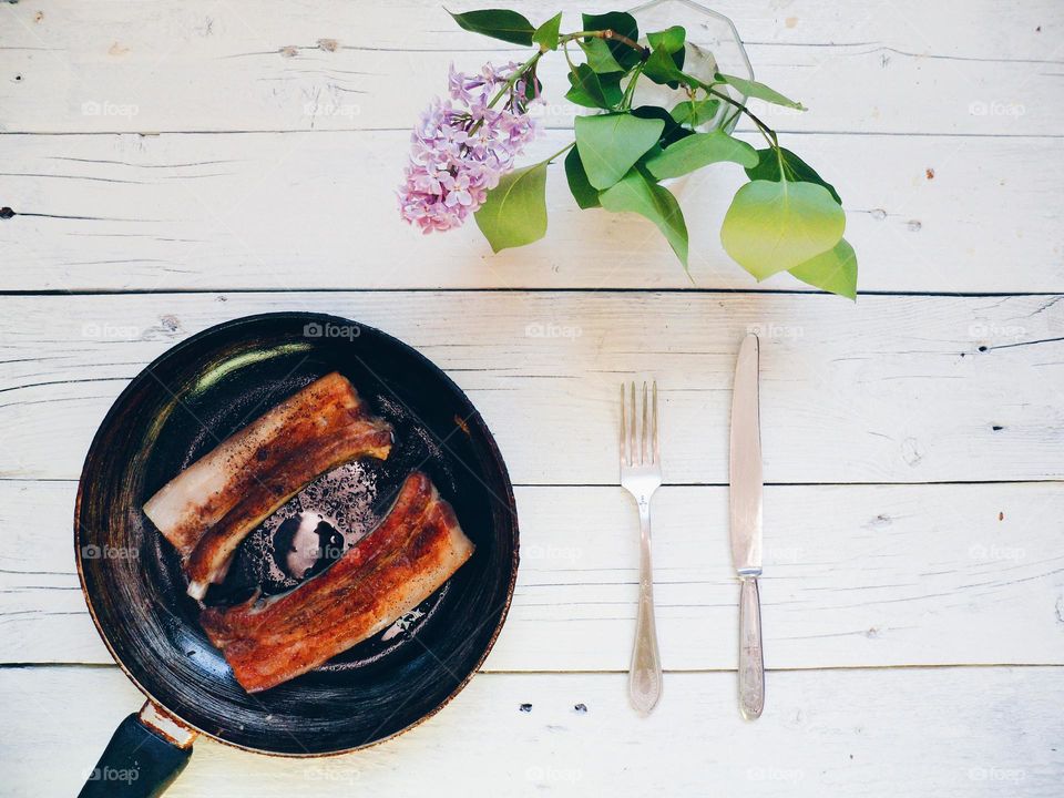 Close-up of roasted pork ribs in a pan