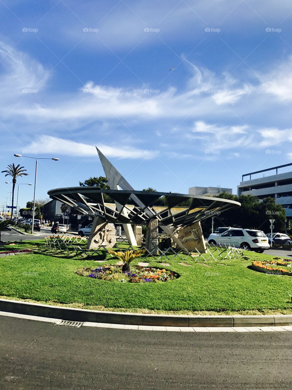 #sundial #flowers #flowerbed #road #city