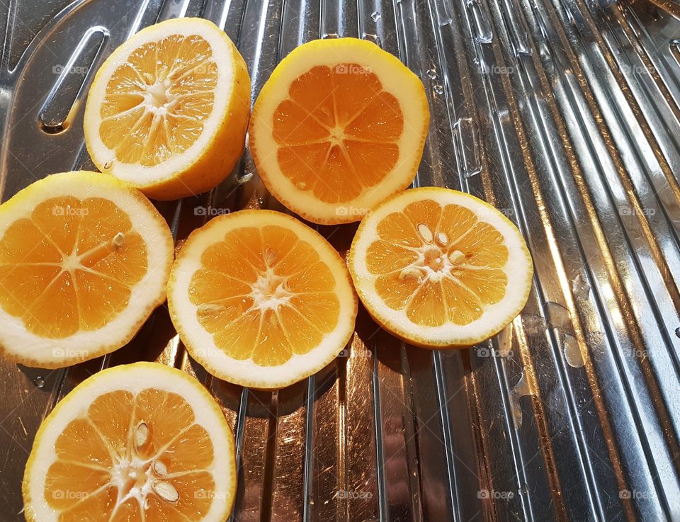 lemon citrus fruit on stainless steel kitchen sink