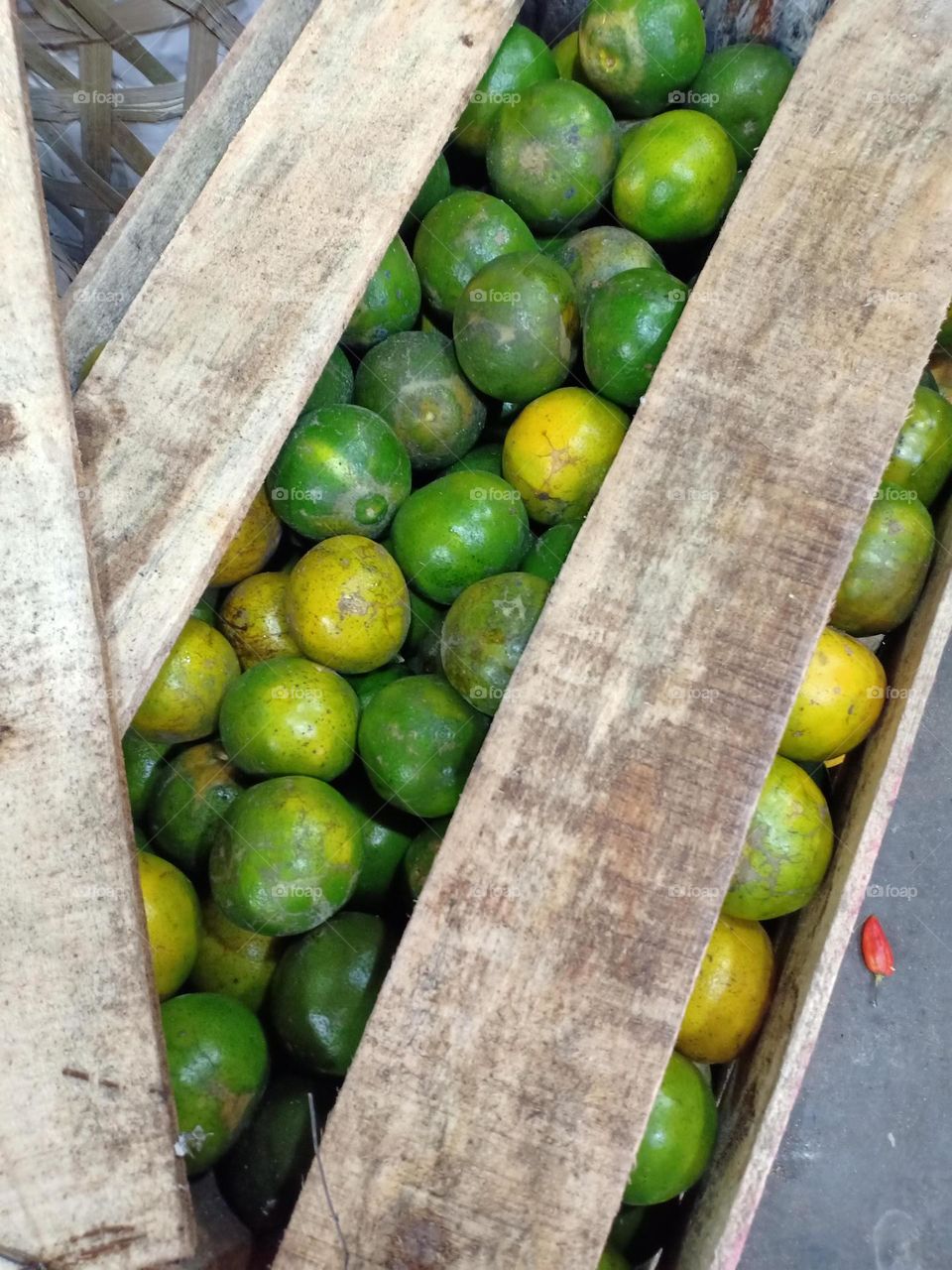citrus fruits stored in wooden crates for shipping
