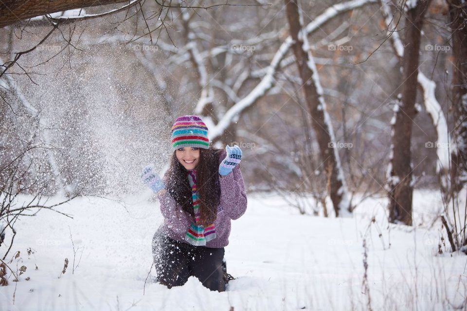 Girl playing with snow 