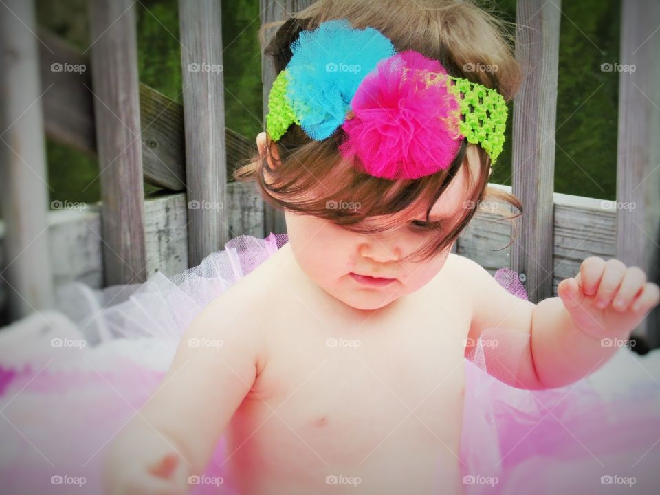 Birthday girl.. One of 400 shots I took of my grand-daughter for her first birthday. she is perfect.