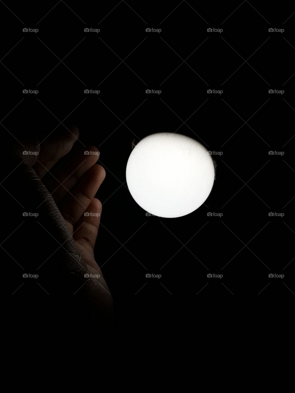 black background and white light with hand. it is very important and beautiful picture it is beautiful wallpaper.