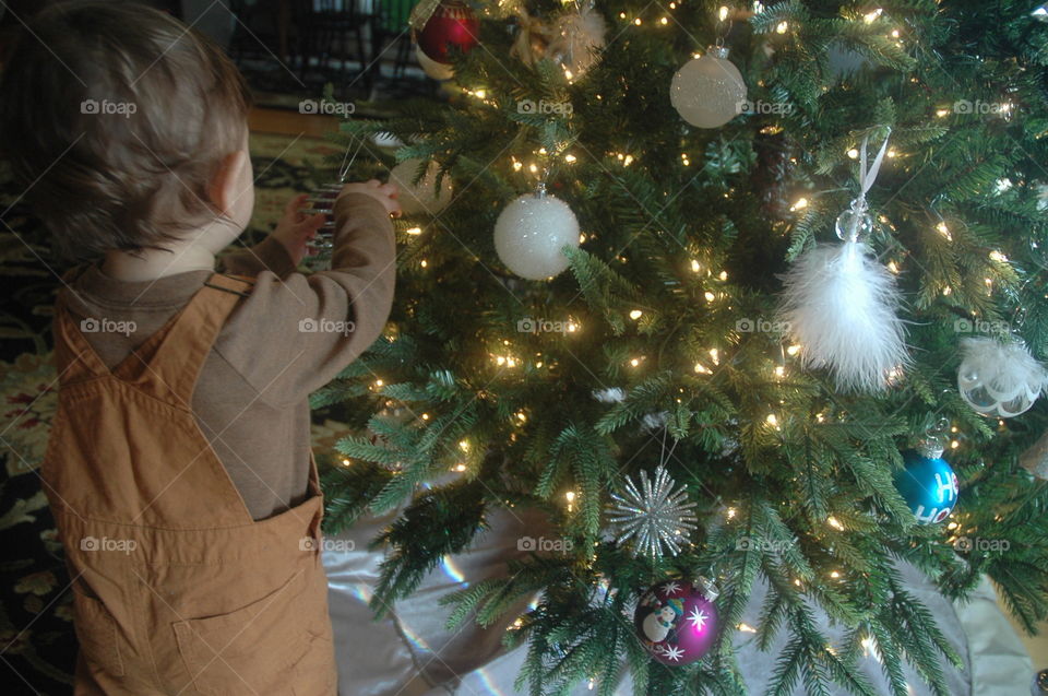 my little boy playing with Christmas tree! #crhistmastree #love
