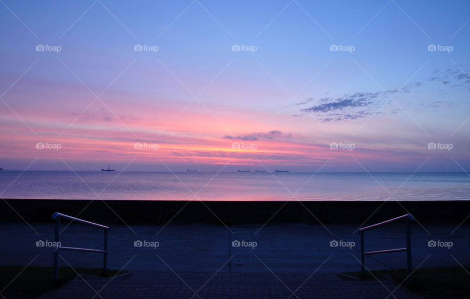 Pier over sea during dawn