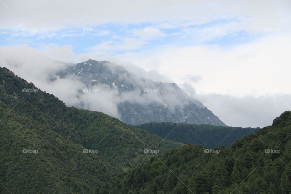 hiking in the mountains 
Dhauladhar mountain ranges of Himalayas in Himachal Pradesh in India