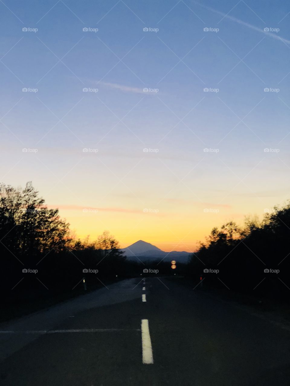 Pyramid mountain, fire sky, road