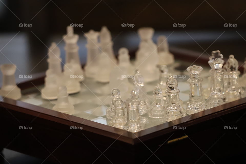 Chess set with glass figures in game 