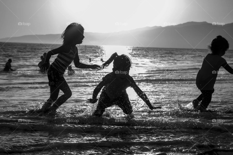 Kids playing at the beach 