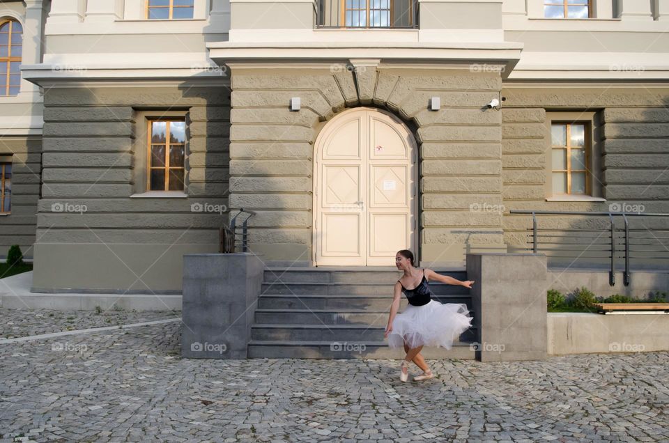 Young Female Ballerina Dancing Outside